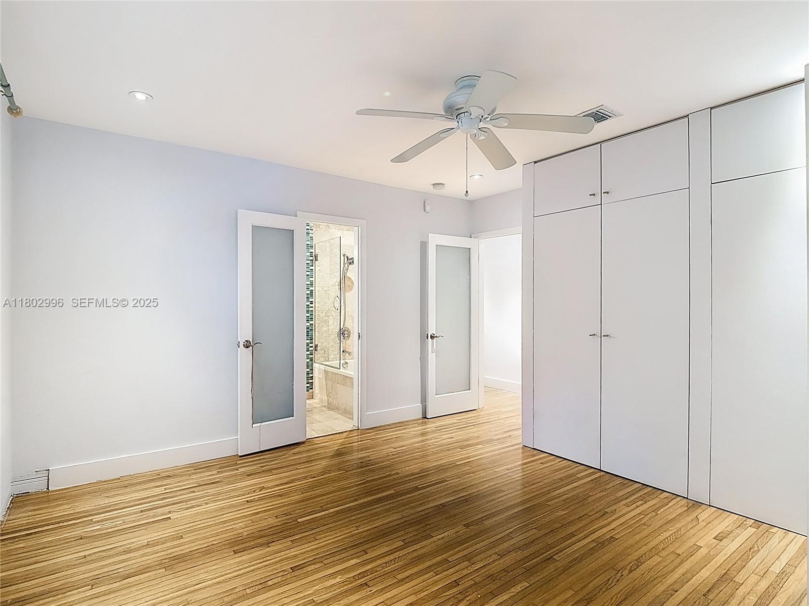 2810 Crystal Court Miami, FL 33133 - Photo 11 of 14 a view of an empty room with wooden floor