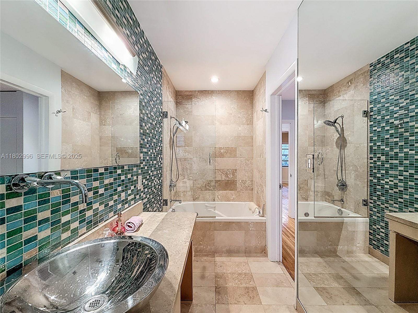 2810 Crystal Court Miami, FL 33133 - Photo 9 of 14 a bathroom with a bathtub and a shower