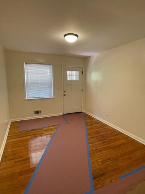 672 Clifton Road Southeast Atlanta, GA 30316 - Photo 3 of 7 a view of an empty room and wooden floor