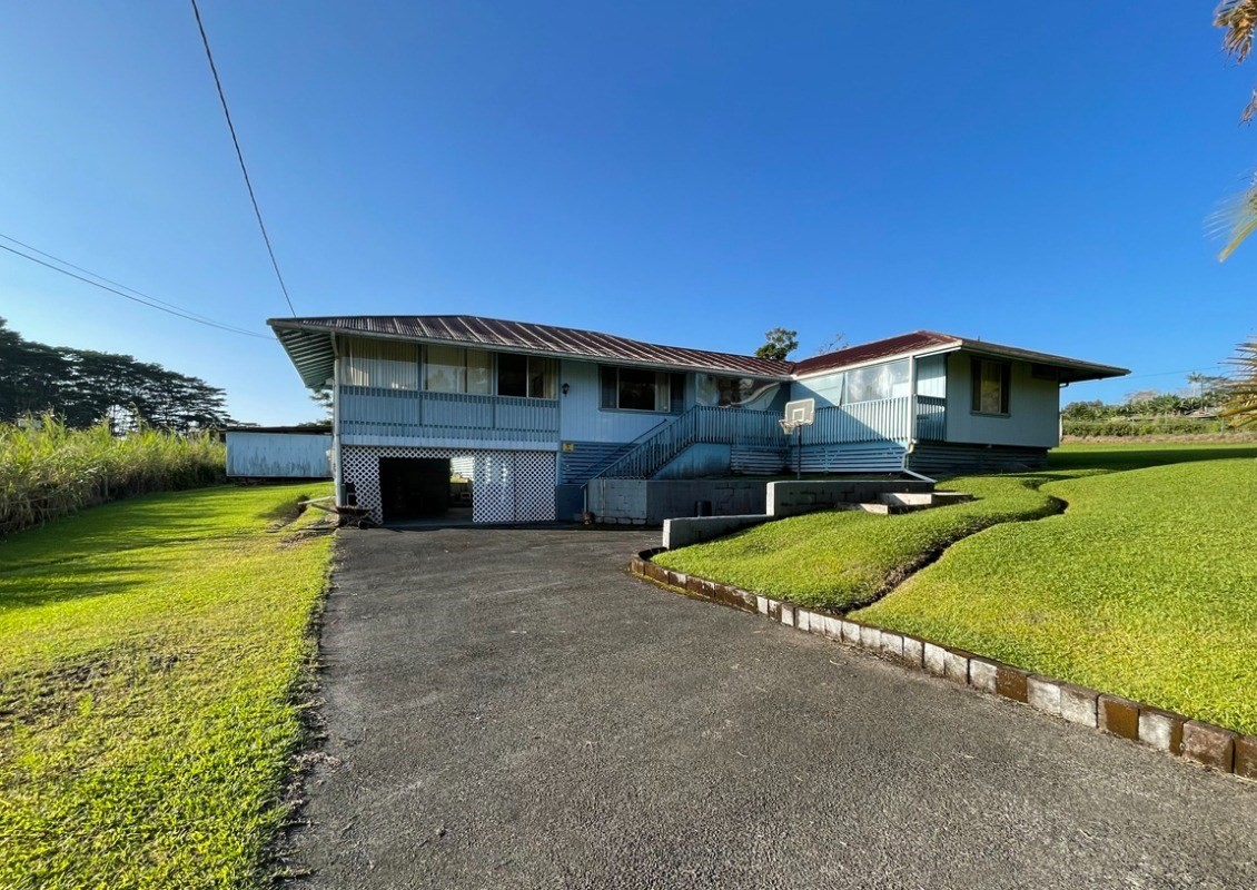 541 Hoaka Road Hilo, HI 96720 - Photo 1 of 9 a front view of house with yard and outdoor seating