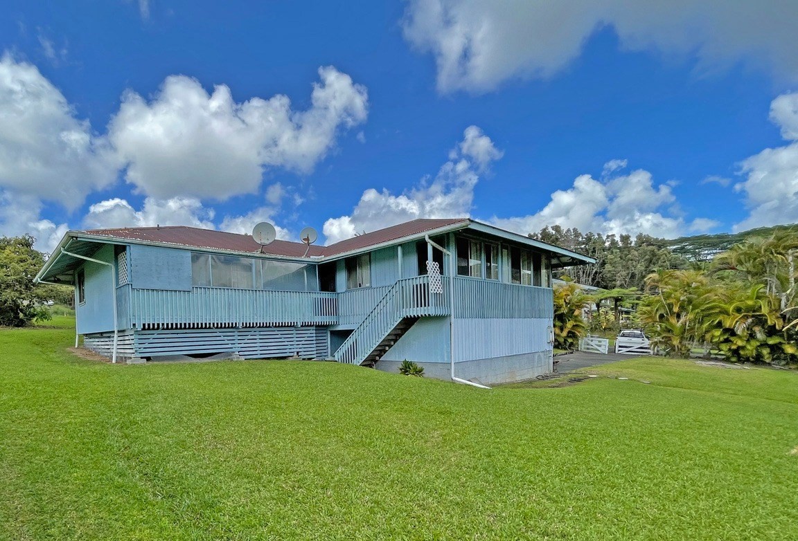 541 Hoaka Road Hilo, HI 96720 - Photo 2 of 9 a view of a house with a yard
