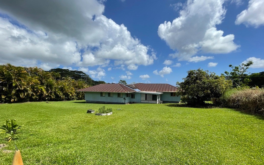 541 Hoaka Road Hilo, HI 96720 - Photo 3 of 9 a view of a big yard with a house in the background