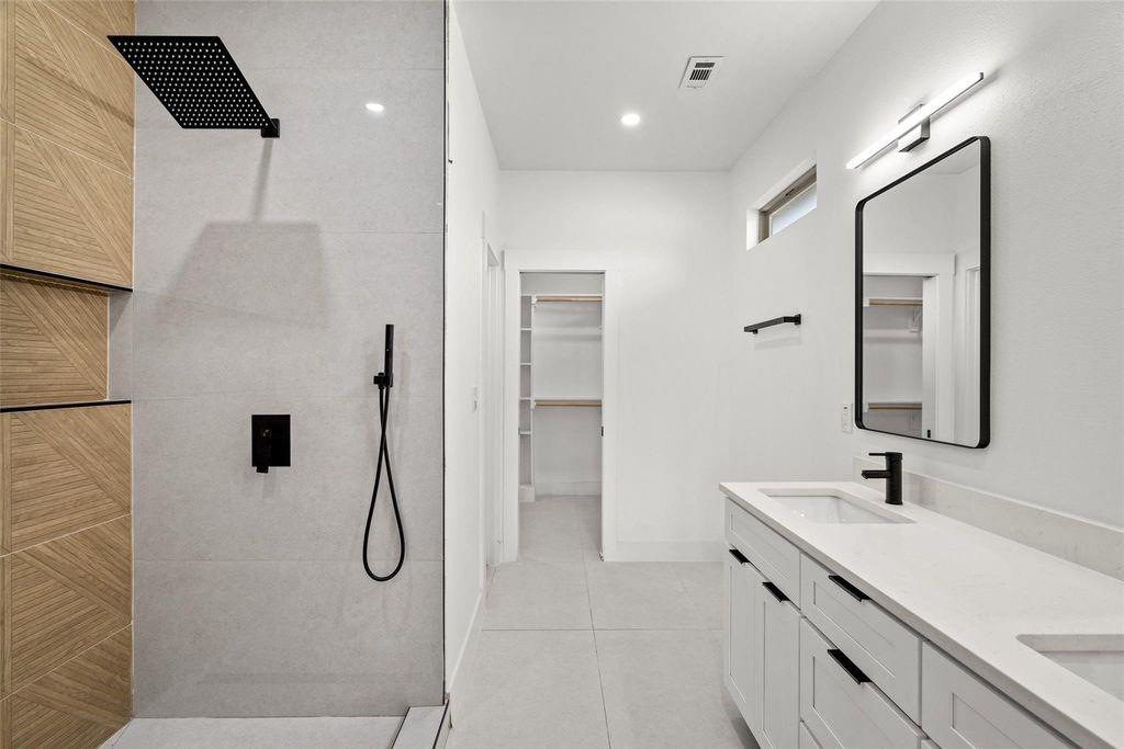 1017 Cedarcrest Drive Mesquite, TX 75149 - Photo 10 of 20 a bathroom with a double vanity sink mirror and shower