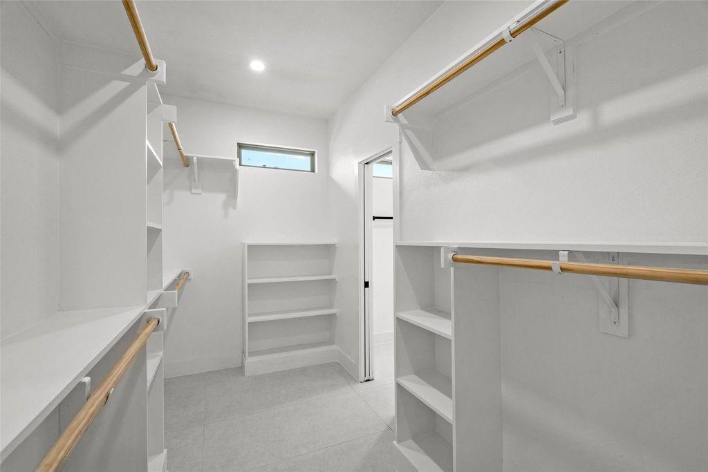 1017 Cedarcrest Drive Mesquite, TX 75149 - Photo 12 of 20 a view of walk in closet with empty racks