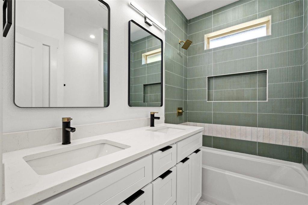 1017 Cedarcrest Drive Mesquite, TX 75149 - Photo 14 of 20 a bathroom with a sink a large mirror and shower