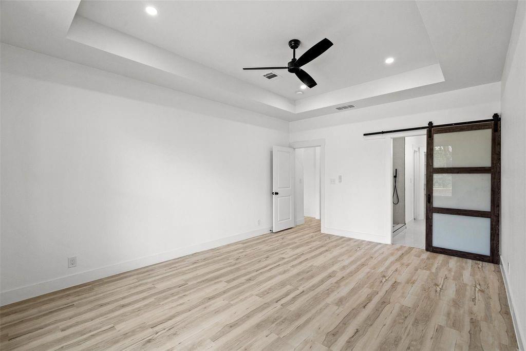 1017 Cedarcrest Drive Mesquite, TX 75149 - Photo 8 of 20 a view of empty room with wooden floor and window