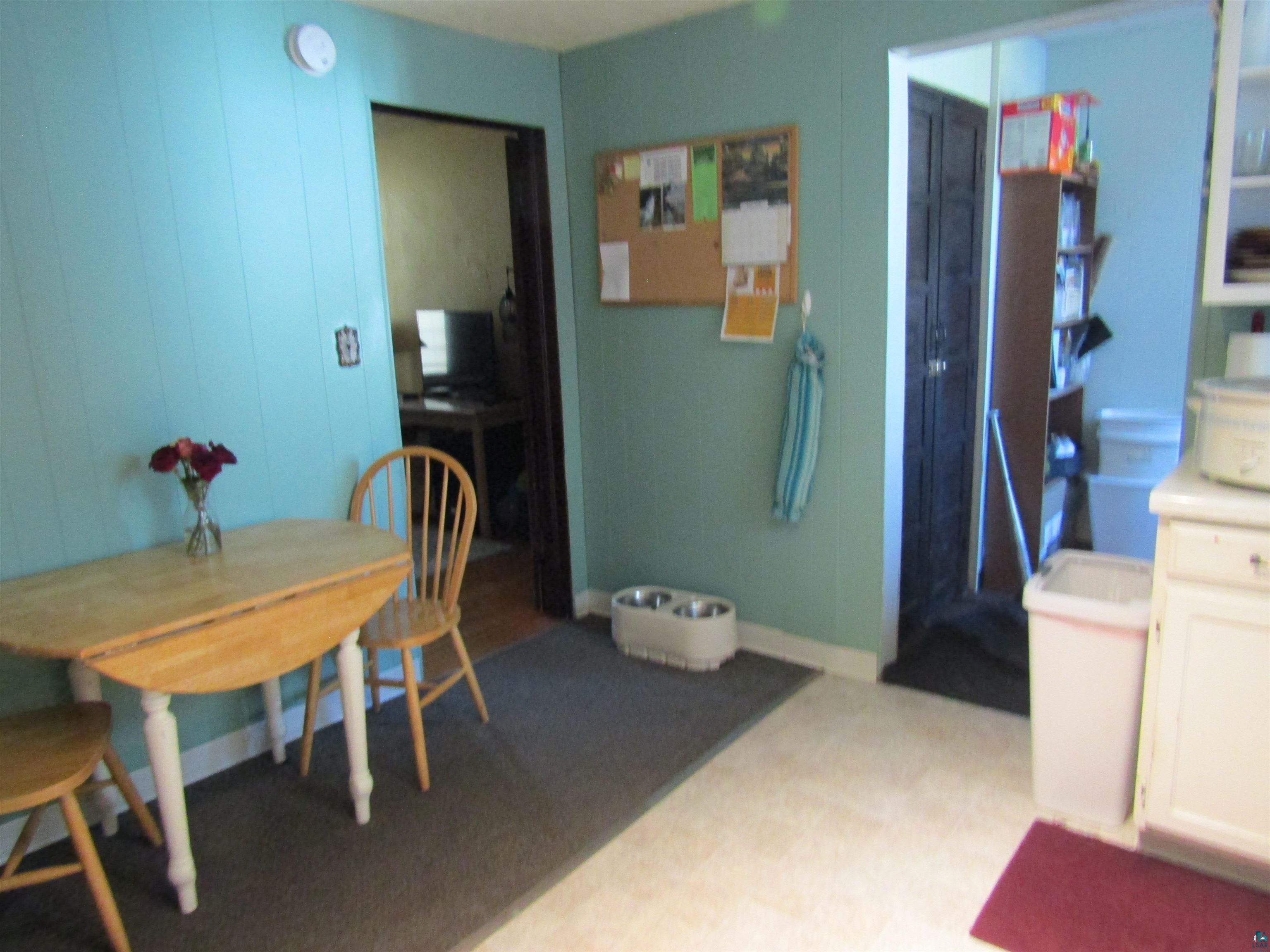 1115 Harrison Street Superior, WI 54880 - Photo 22 of 49 Kitchen area featuring paneling walls, resilient flooring, and an open doorway to another room