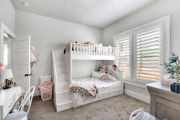 a bedroom with a bed and a couch