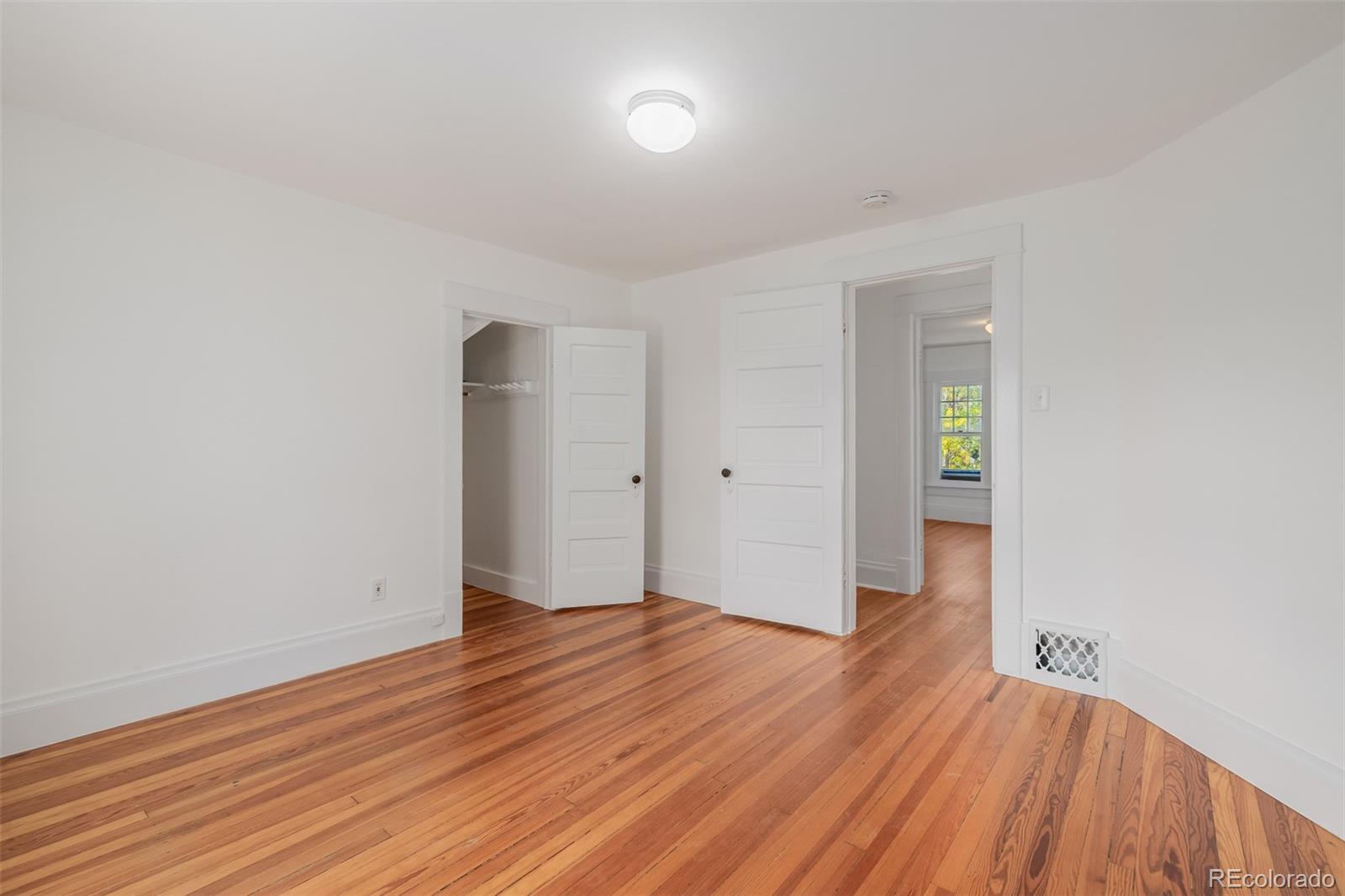 3534 Clay Street Denver, CO 80211 - Photo 18 of 50 wooden floor in an empty room with a window