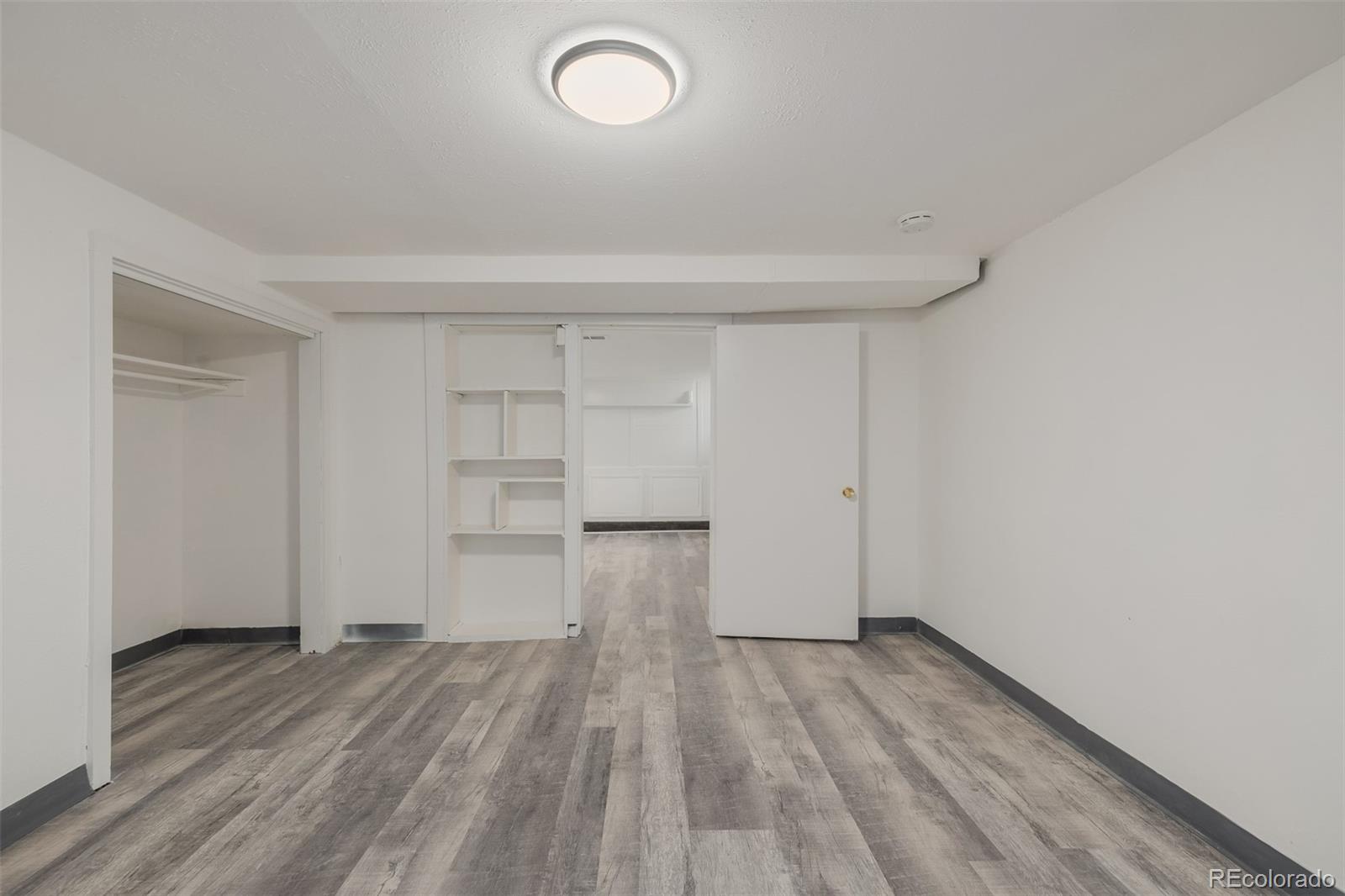 3534 Clay Street Denver, CO 80211 - Photo 30 of 50 a view of empty room with wooden floor