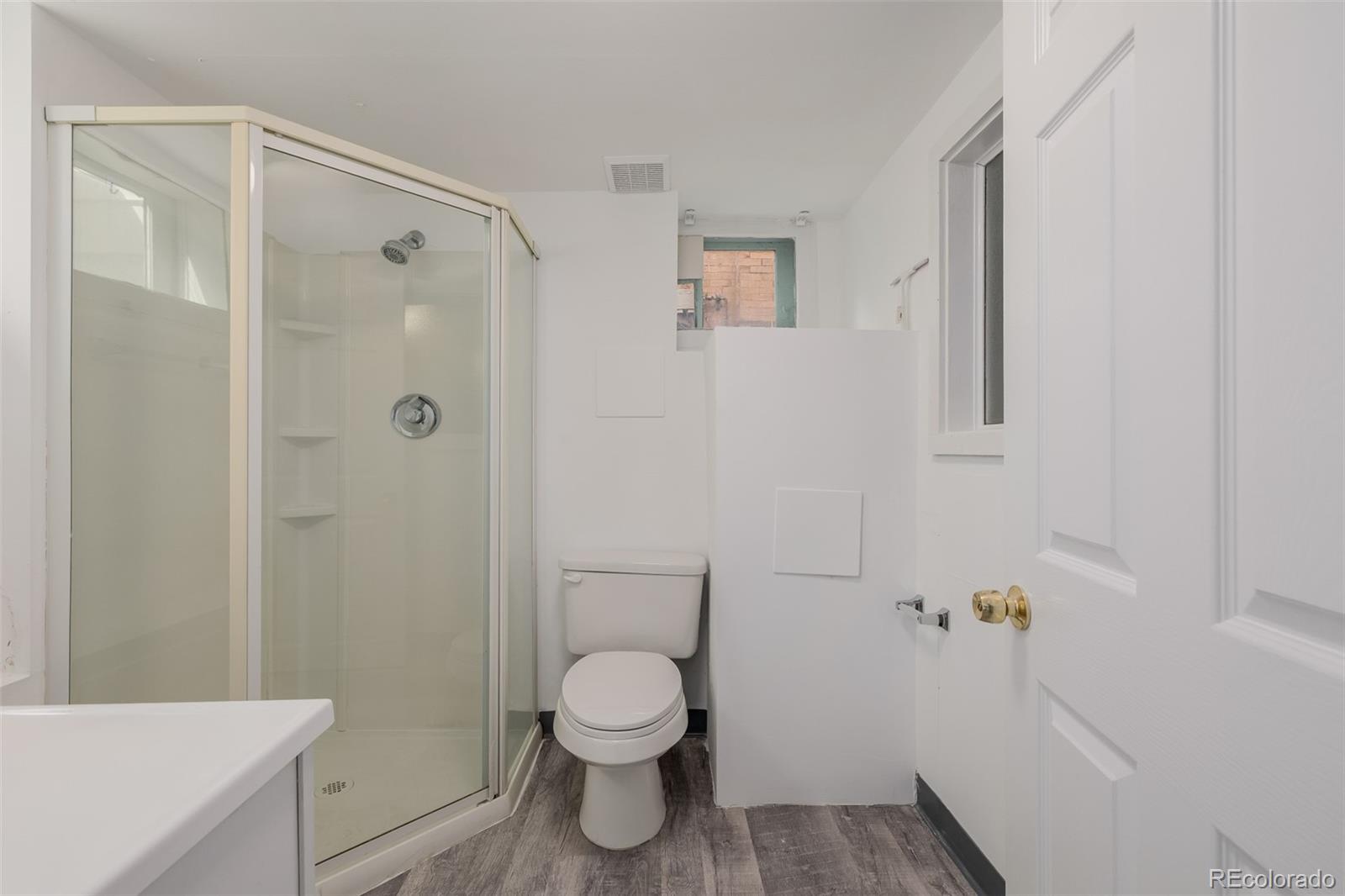 3534 Clay Street Denver, CO 80211 - Photo 31 of 50 a bathroom with a toilet and a shower
