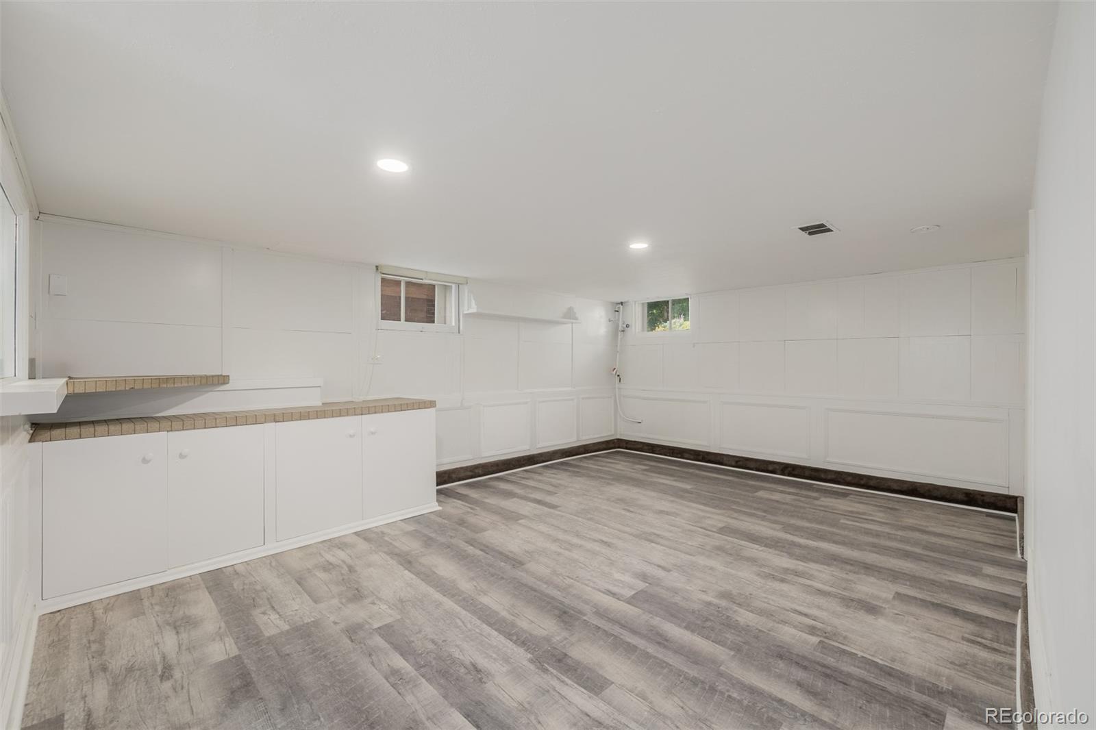 3534 Clay Street Denver, CO 80211 - Photo 35 of 50 a view of a room with wooden floor and white walls