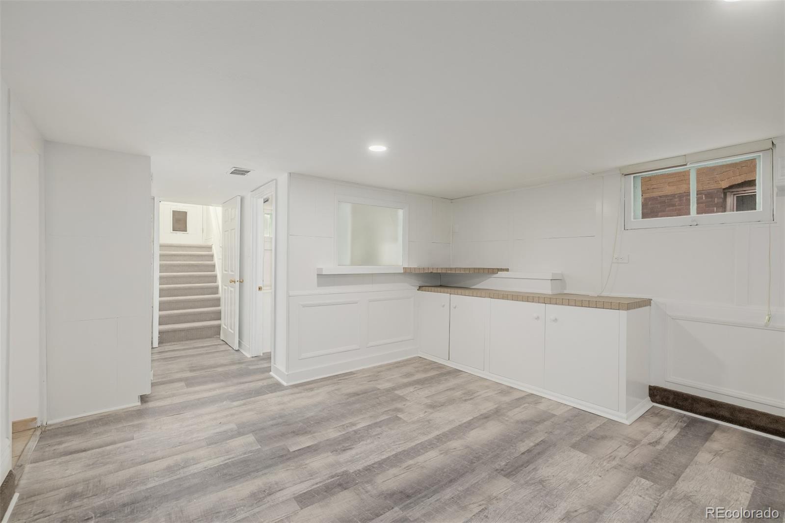 3534 Clay Street Denver, CO 80211 - Photo 36 of 50 a view of empty room with wooden floor and window