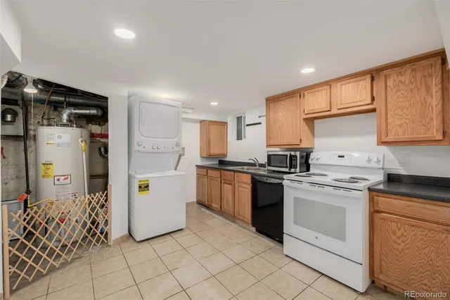 a kitchen with a sink stove and white cabinets