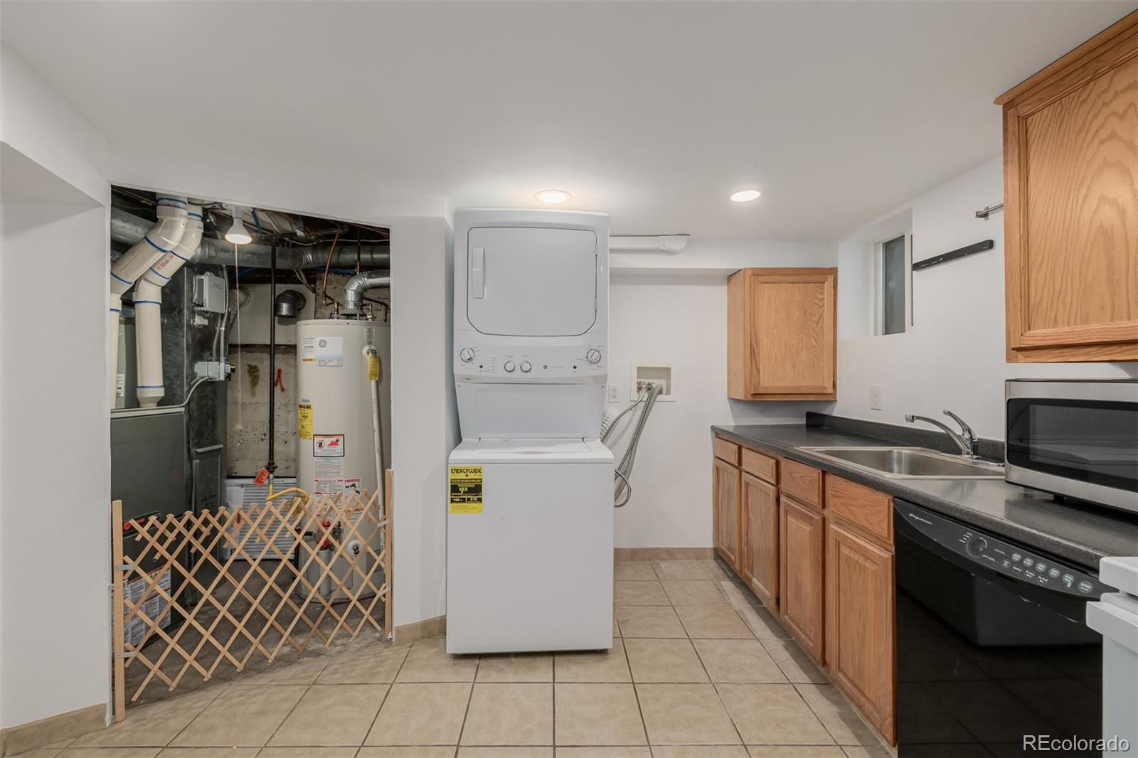 3534 Clay Street Denver, CO 80211 - Photo 39 of 50 a kitchen with stainless steel appliances granite countertop a refrigerator and a stove