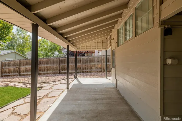 a view of a backyard with a sitting area