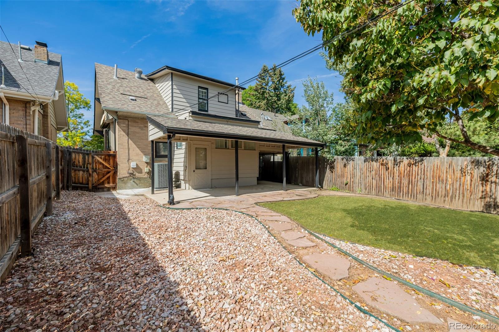 3534 Clay Street Denver, CO 80211 - Photo 45 of 50 a front view of a house with a yard and trees