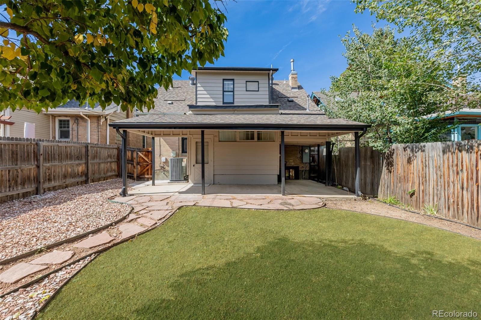 3534 Clay Street Denver, CO 80211 - Photo 48 of 50 a front view of a house with a garden and trees