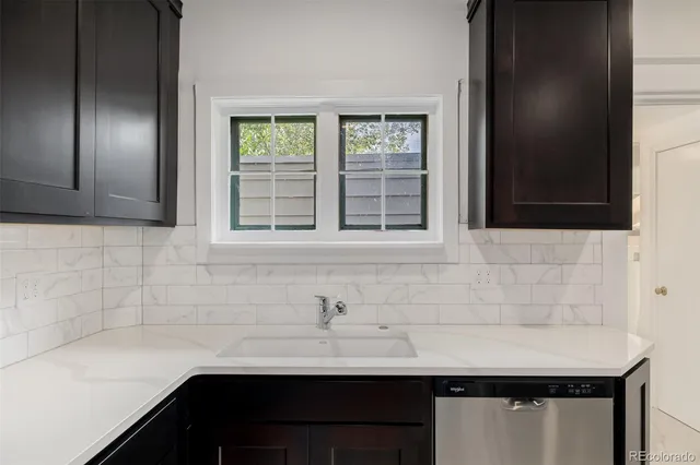 a bathroom with a sink and a window