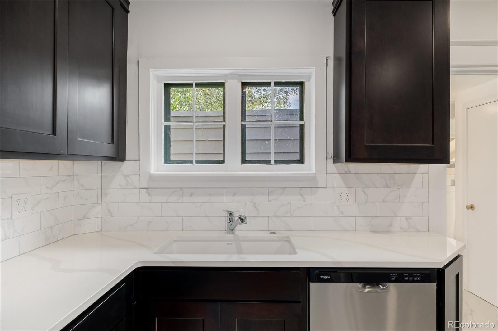 3534 Clay Street Denver, CO 80211 - Photo 5 of 50 a bathroom with a sink and a window