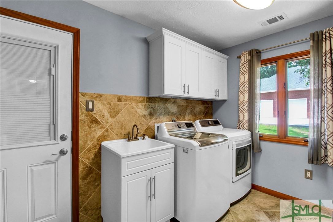 311 Merion Road Rincon, GA 31326 - Photo 30 of 45 Laundry with sink and added cabinets