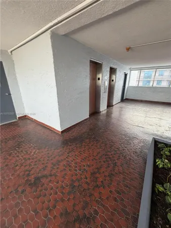 a view of a livingroom with wooden floor and stairs