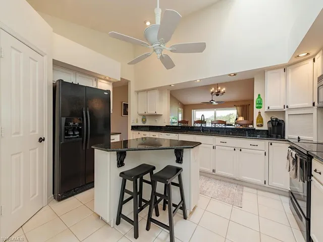a kitchen with stainless steel appliances a refrigerator and a stove