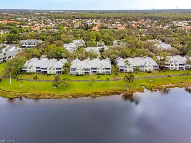 an aerial view of a house with a swimming pool outdoor seating and yard