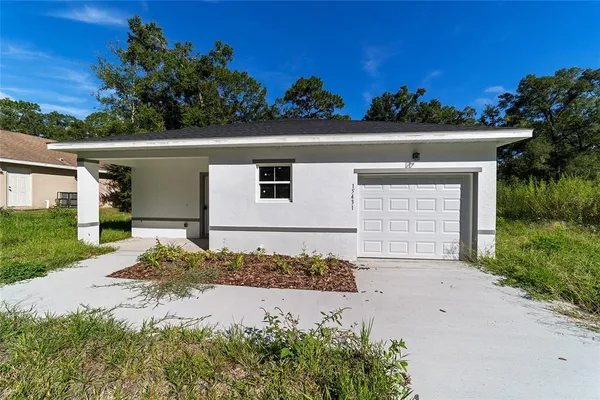 front view of a house with a yard