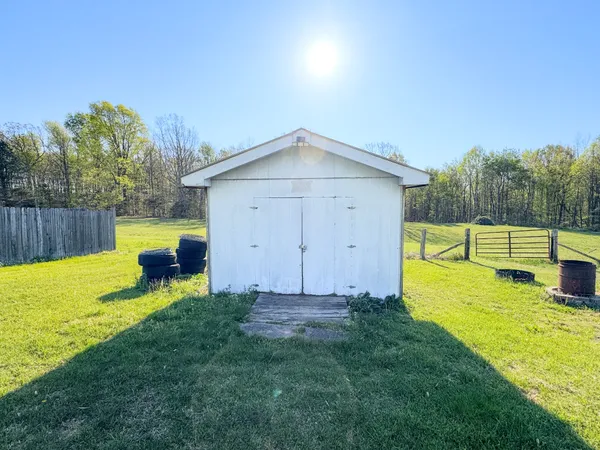 a view of a backyard with swimming pool