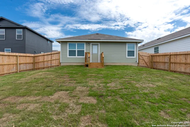 a view of a backyard with a tub