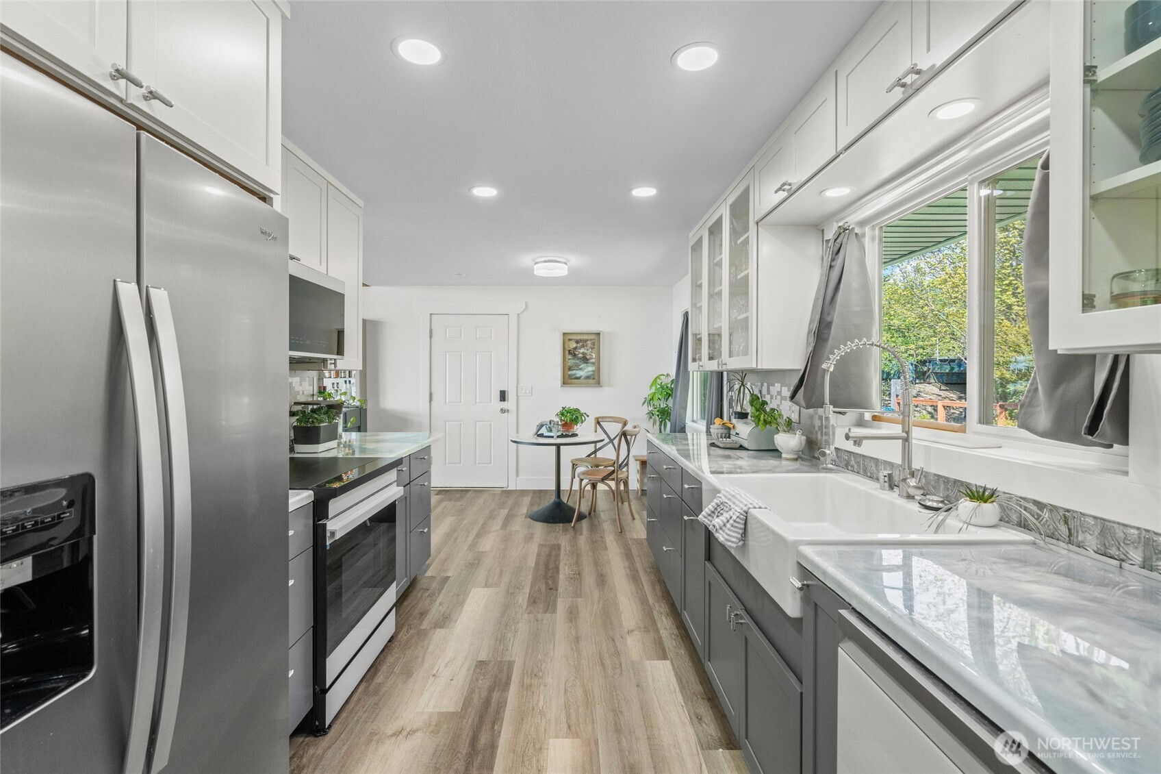 3161 Locust Avenue Bellingham, WA 98225 - Photo 14 of 40 a large kitchen with granite countertop a large counter top stainless steel appliances and a large window