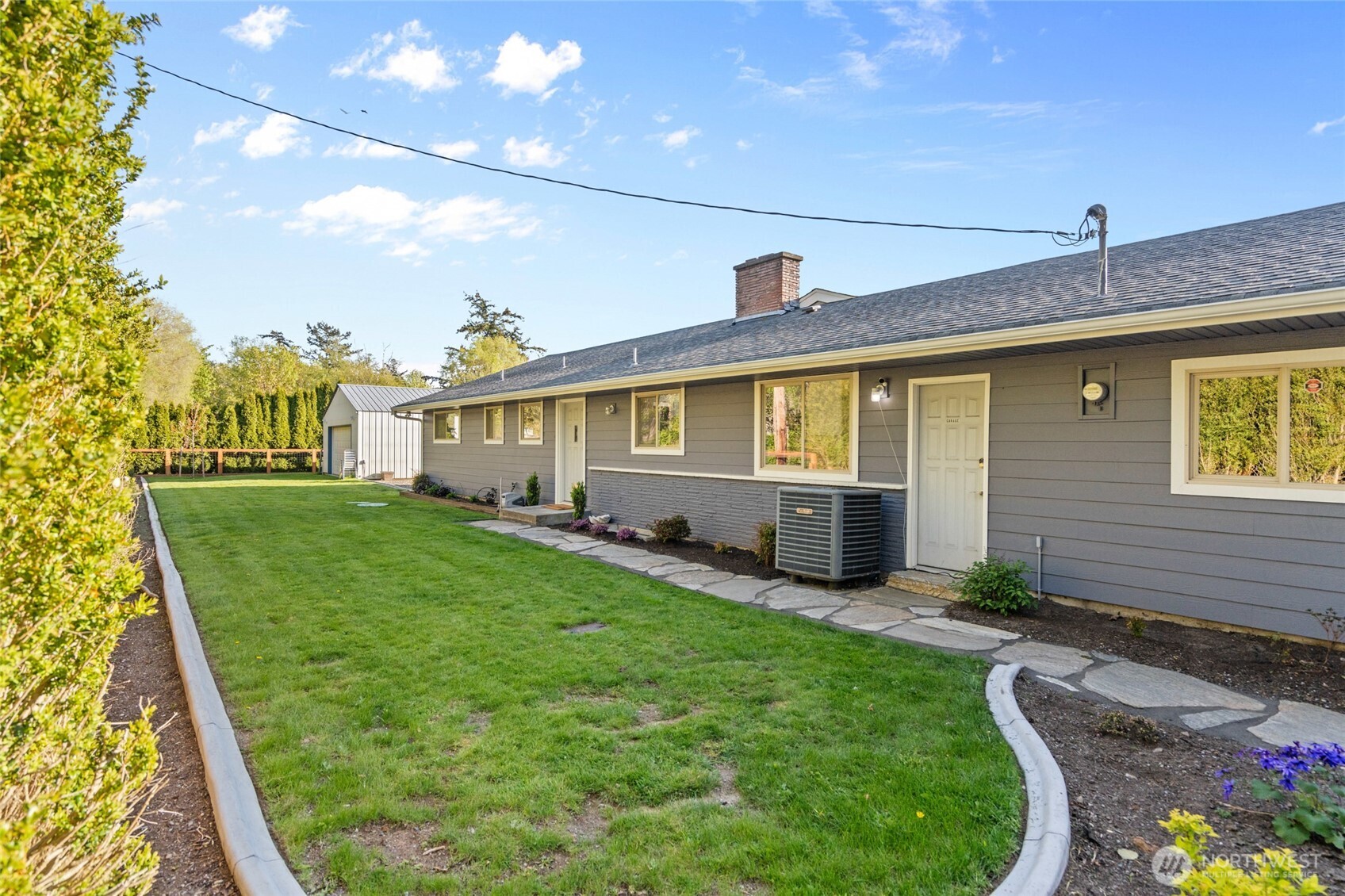3161 Locust Avenue Bellingham, WA 98225 - Photo 32 of 40 a front view of a house with garden