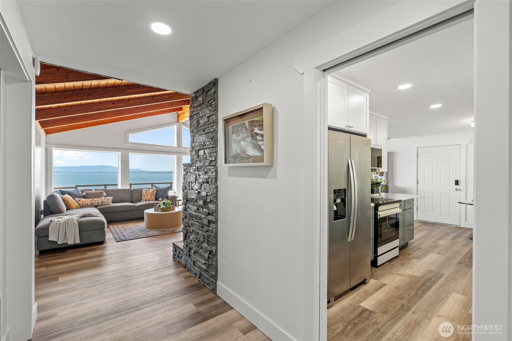 3161 Locust Avenue Bellingham, WA 98225 - Photo 6 of 40 a view of living room kitchen with furniture and stainless steel appliances
