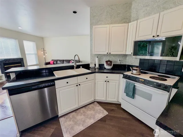 a workspace with furniture and window