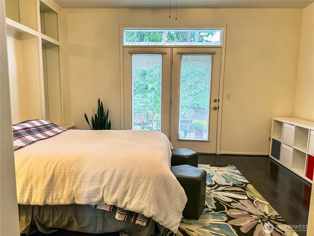 a view of a patio with furniture and a garden