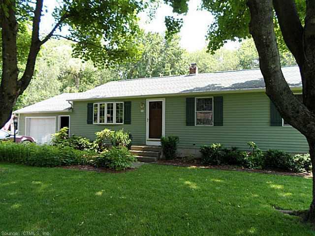a view of a house with a yard and a garden