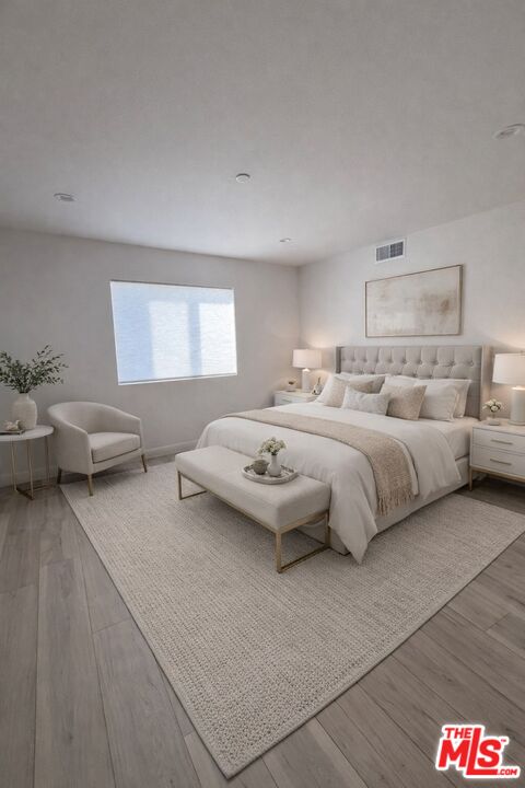 121 East 223rd Street, Unit 4 Carson, CA 90745 - Photo 11 of 14 a bedroom with bed and a couch