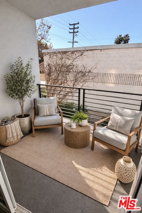 121 East 223rd Street, Unit 4 Carson, CA 90745 - Photo 14 of 14 a living room with furniture and a potted plant