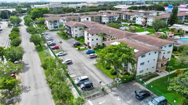 an aerial view of multiple houses with yard