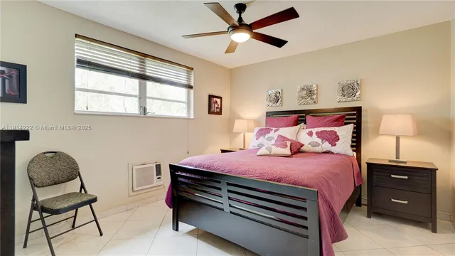 a bedroom with a bed and a chair