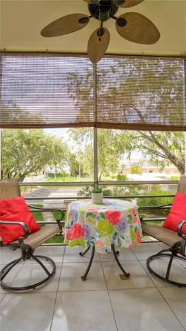 a view of a balcony with potted plants