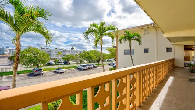 swimming pool view with a garden view