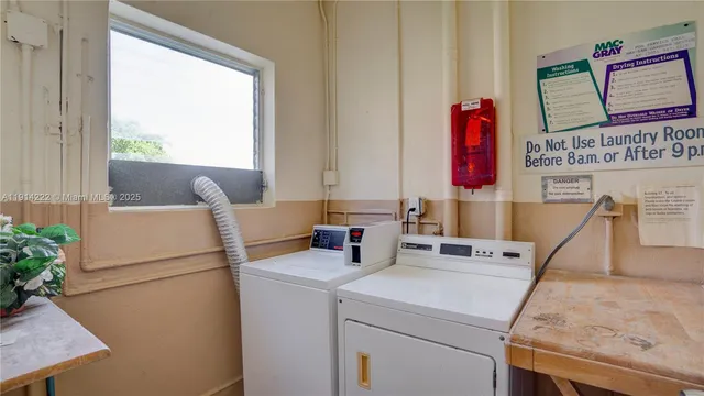 a patio with a table and chairs under an umbrella