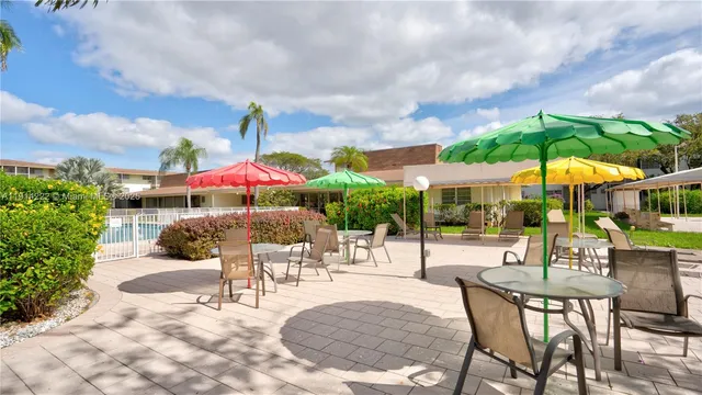 a living room with lots of furniture and a book shelf