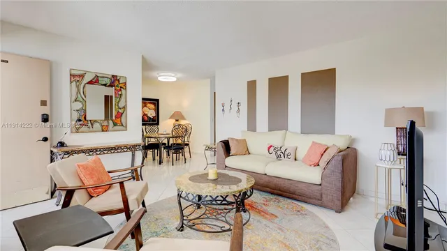 a living room with furniture and a night stand