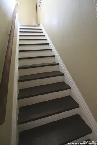 a bedroom with double bed and a large mirror