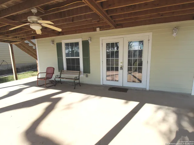 a view of a swimming pool with a patio