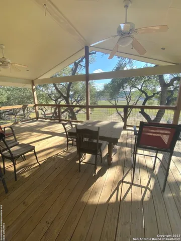 a view of a swimming pool with a patio