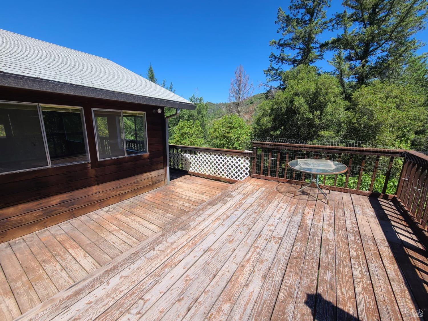 3620 Eel River Ranch Road Covelo, CA 95428 - Photo 17 of 27 a view of balcony with wooden floor and fence